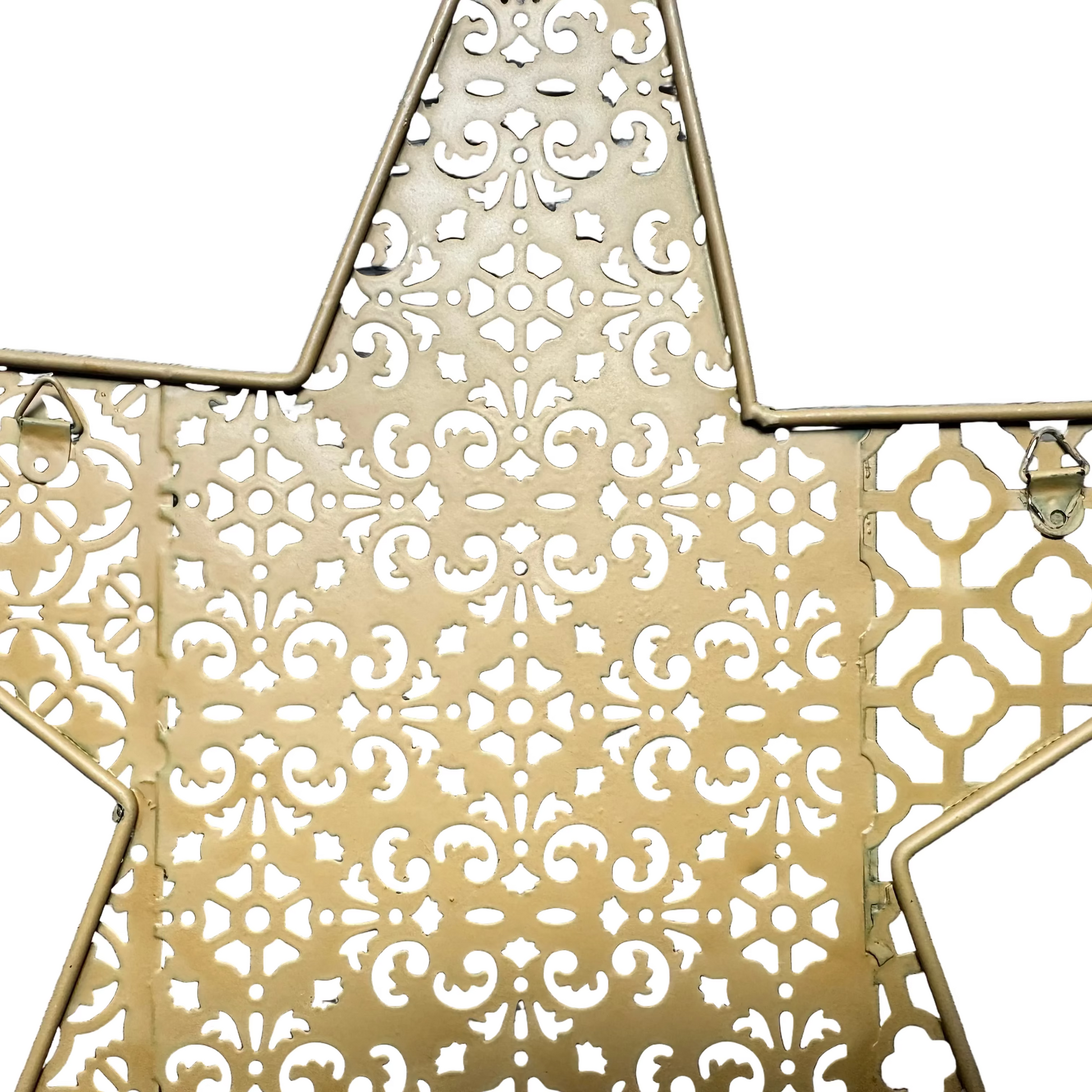 A close-up of a gold-toned metal star-shaped decorative piece with an intricate cutout filigree pattern, shown against a plain white background.