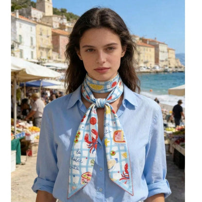 Woman wearing a colorful scarf with a scenic background
