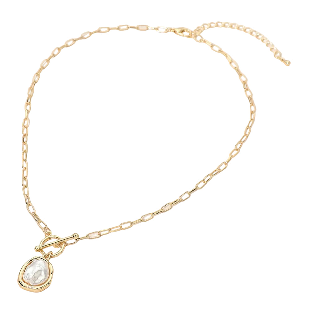 Gold necklace with a organic-shaped pearl pendant on a white background