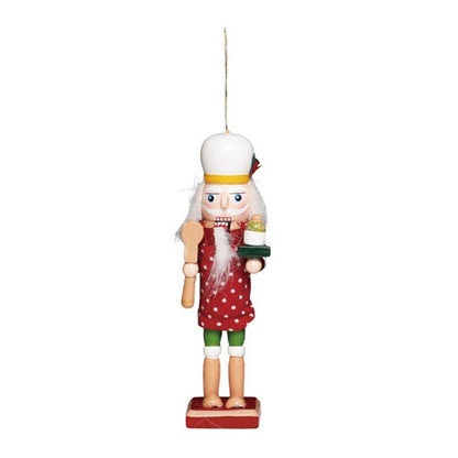 A small baker chef cook Christmas nutcracker figurine with a white hat, red dress, green shorts, and a red base, shown against a plain white background.