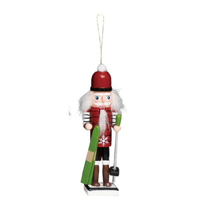 Wood skier nutcracker Christmas ornament holding green skis and a ski pole.