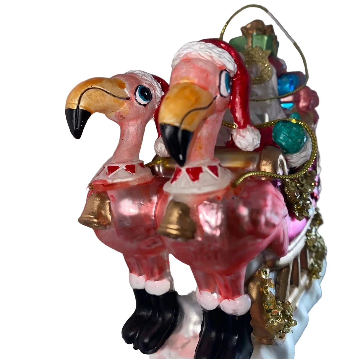 Pink Flamingo Sleigh with Santa glass Christmas ornament features Santa, colorful gifts, glitter and gold accents for a whimsical tropical holiday tree.