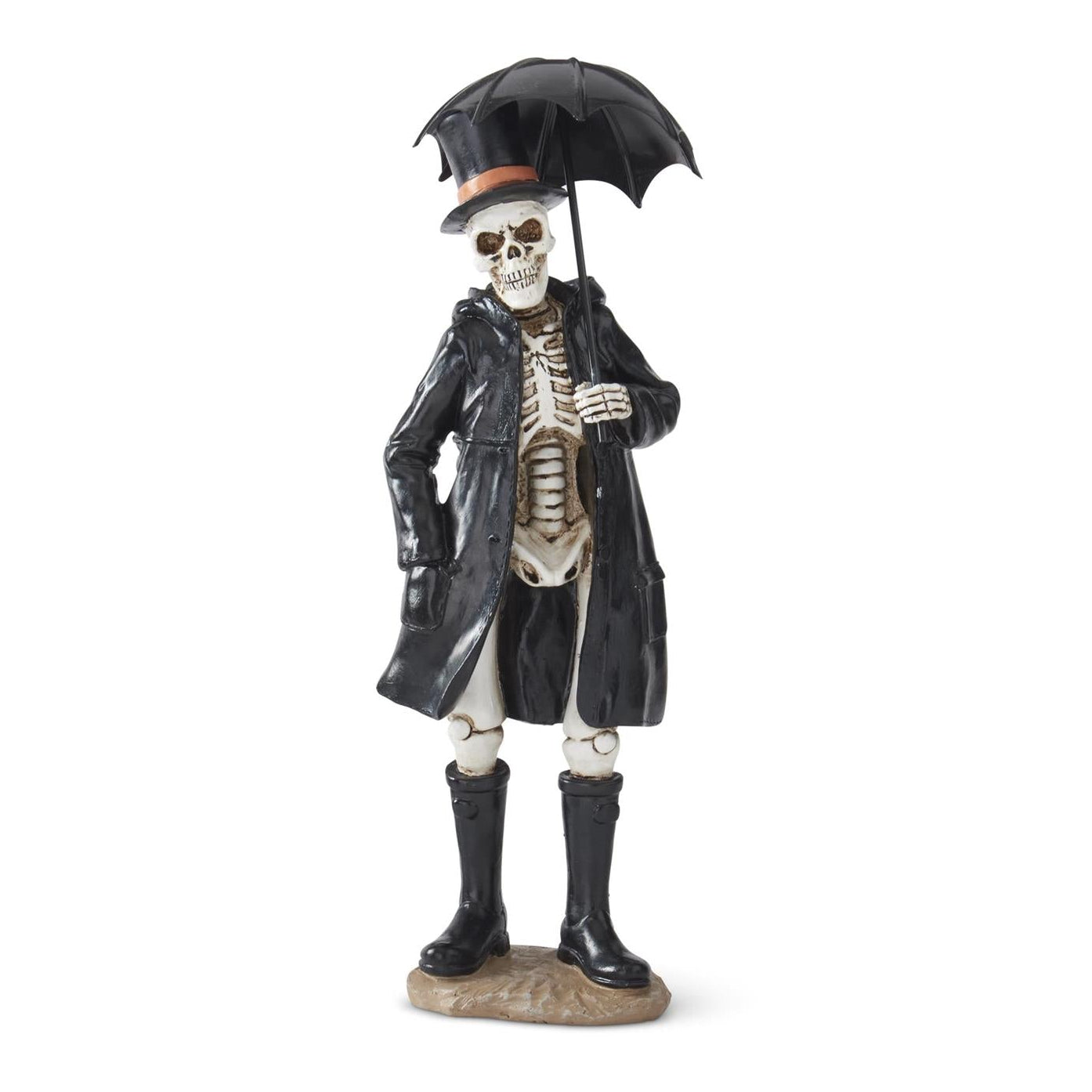 A gothic skeleton figurine dressed in a black trench coat, black rain boots, and a black top hat with an umbrella, standing on a small rock base against a white background.