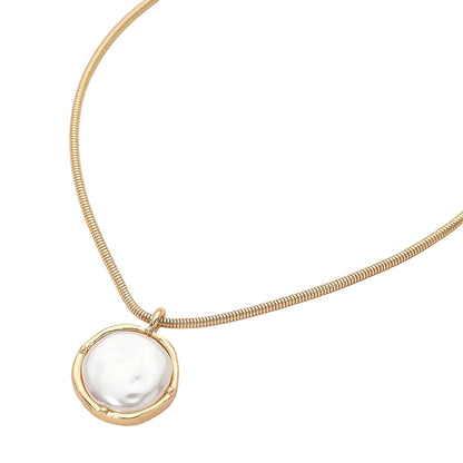 Gold necklace with a pearl pendant on a white background