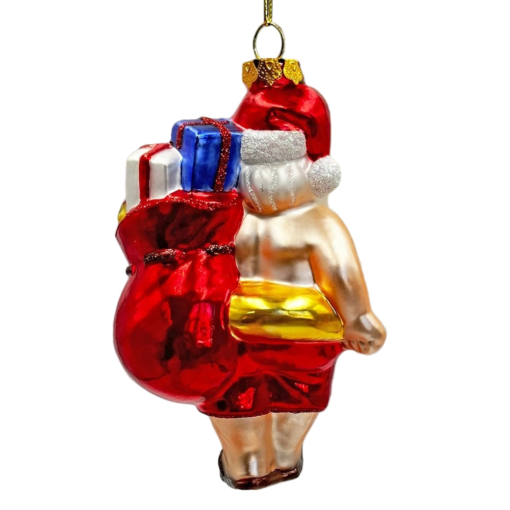 Decorative Christmas ornament of a man in a swimsuit with gifts, hanging on a tree.