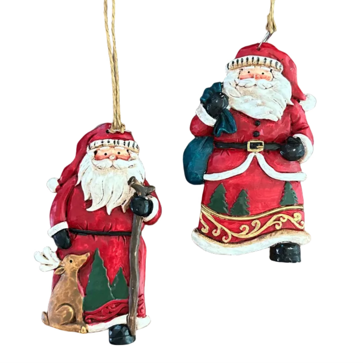 Two hand-painted Christmas ornaments depicting Santa Claus in red and white suits, one holding a walking stick and a reindeer, and the other holding a sack, both hanging from twine on a white background.
