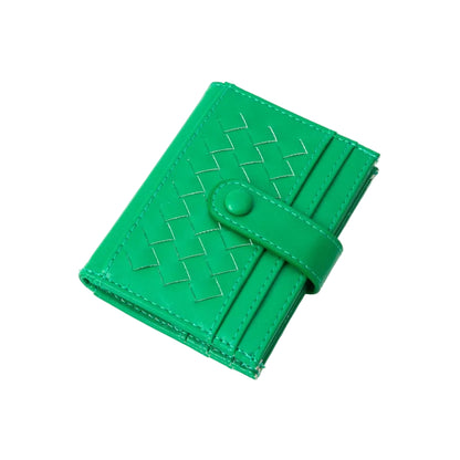 Green woven wallet on a white background