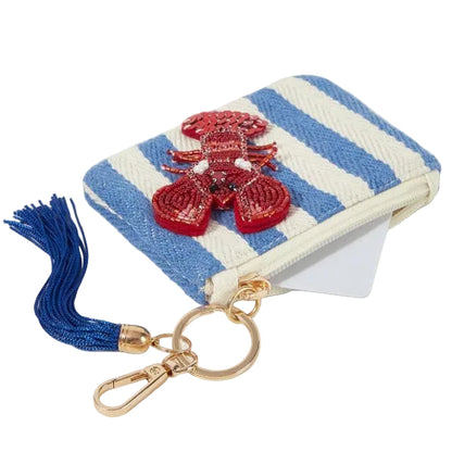 Blue and white striped nautical coin purse featuring sparkling beaded red lobster with sequins, a blue tassel, zipper closure and gold-tone keychain clip.