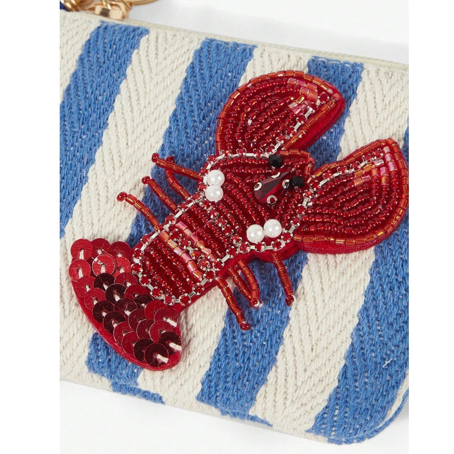 Blue and white striped nautical coin purse featuring sparkling beaded red lobster with sequins, a blue tassel, zipper closure and gold-tone keychain clip.