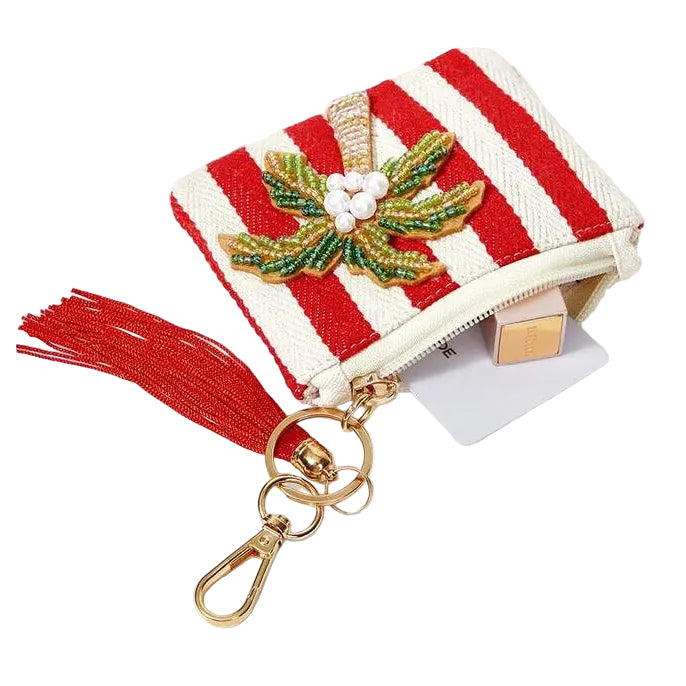 Red and white striped tropical coin purse featuring sparkling beaded palm tree with a red tassel, zipper closure and gold-tone keychain clip.