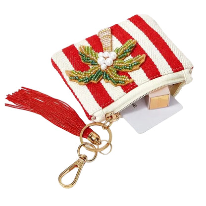 Red and white striped tropical coin purse featuring sparkling beaded palm tree with a red tassel, zipper closure and gold-tone keychain clip.