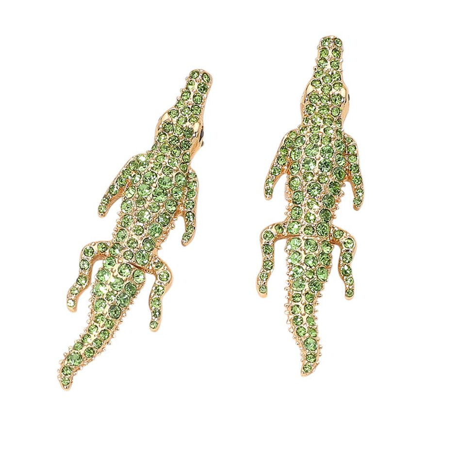 Green crocodile-shaped earrings on a white background