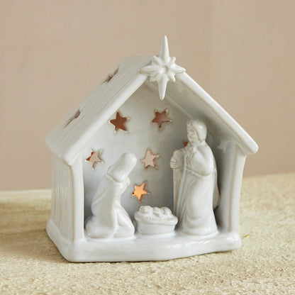 White nativity scene figurine with stars on a beige background