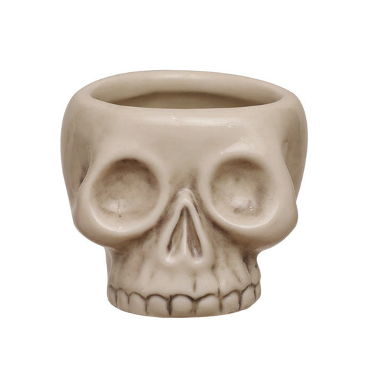 Stoneware skull-shaped toothpick holder with an antique bone finish for Halloween, gothic décor, or everyday tabletop use.