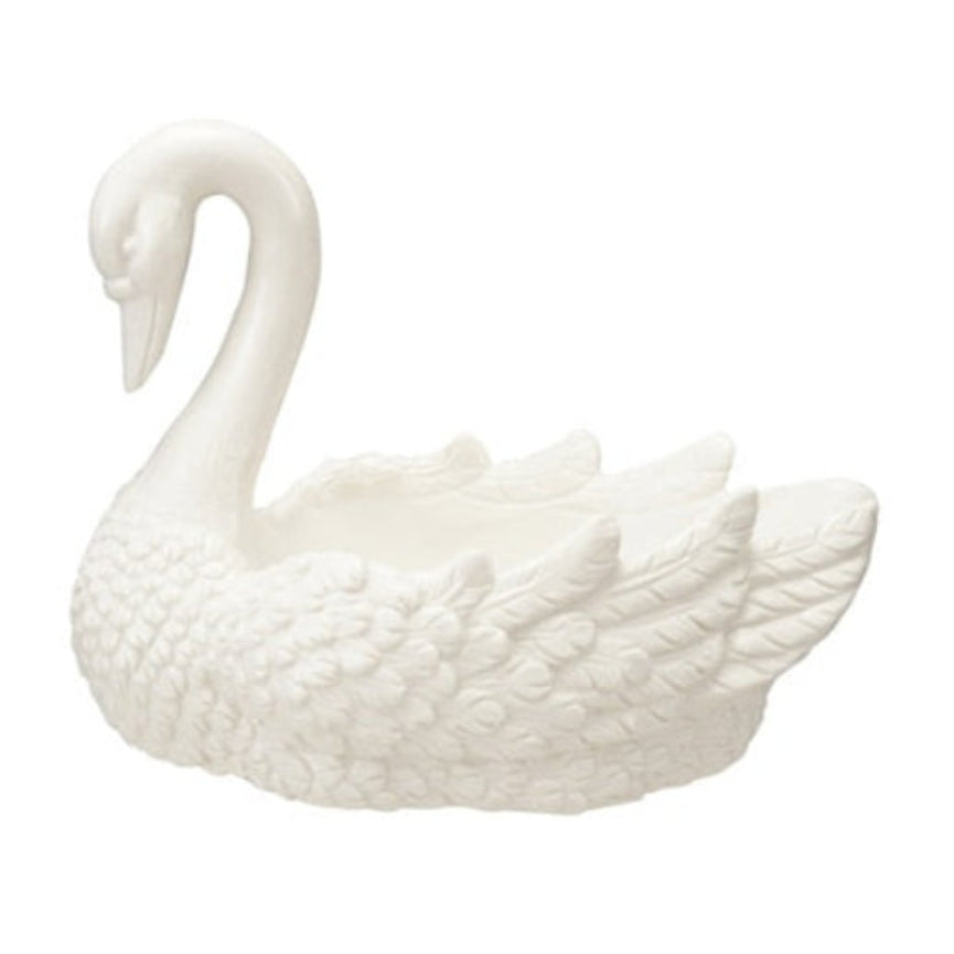 White stoneware swan-shaped dish with a curved neck and detailed feathered wings.