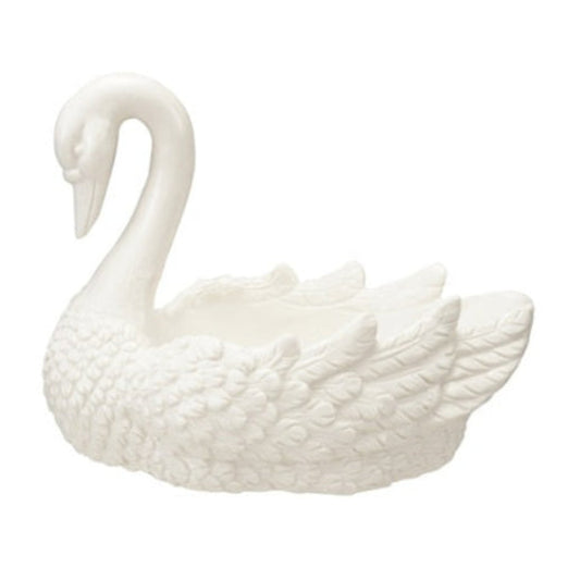 White stoneware swan-shaped dish with a curved neck and detailed feathered wings.