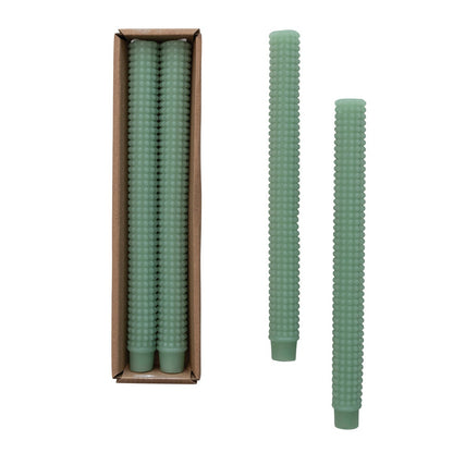 A set of two sea green hobnail design taper candles presented in a box, with one candle displayed outside the box.