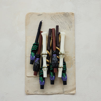 Collection of decorative sticks on a textured surface