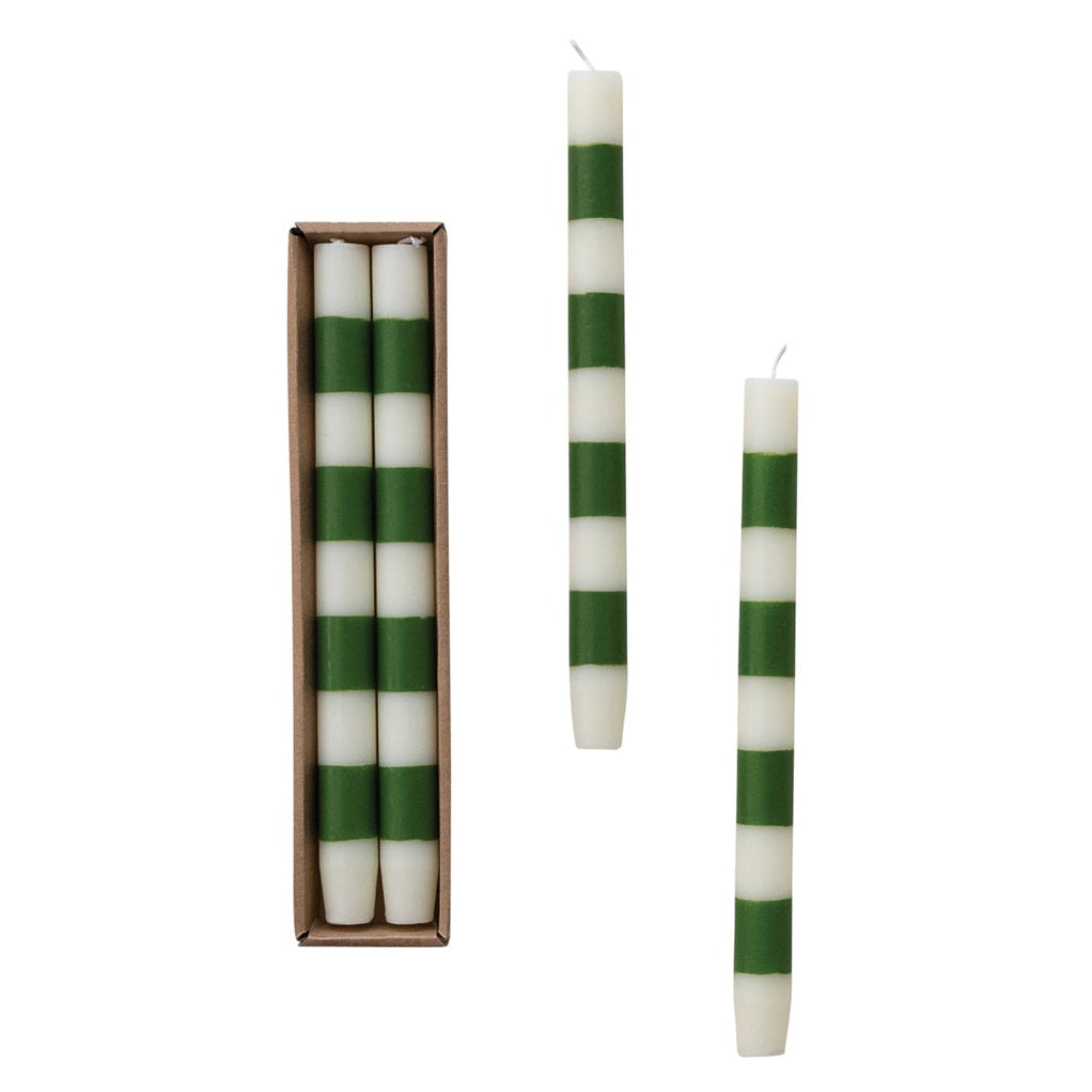 Set of two 10-inch cream and green striped taper candles displayed beside their kraft box.