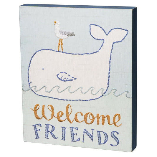 Welcome Friends whale and seagull box sign with charming embroidered-style details. A sweet nautical accent for an entryway, guest room or nursery.