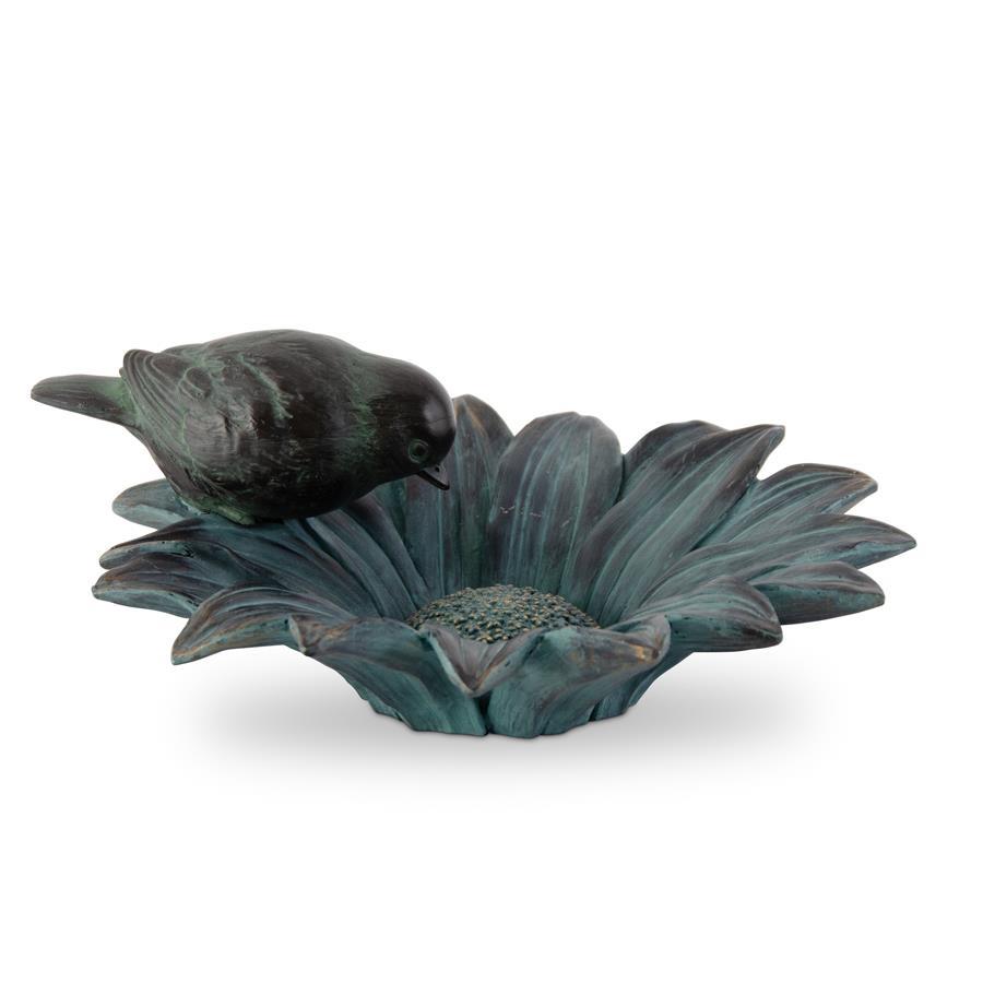 Charming sunflower bird feeder bowl in patina green with gold highlights. Features sculpted petals and a perched bird for whimsical garden décor.